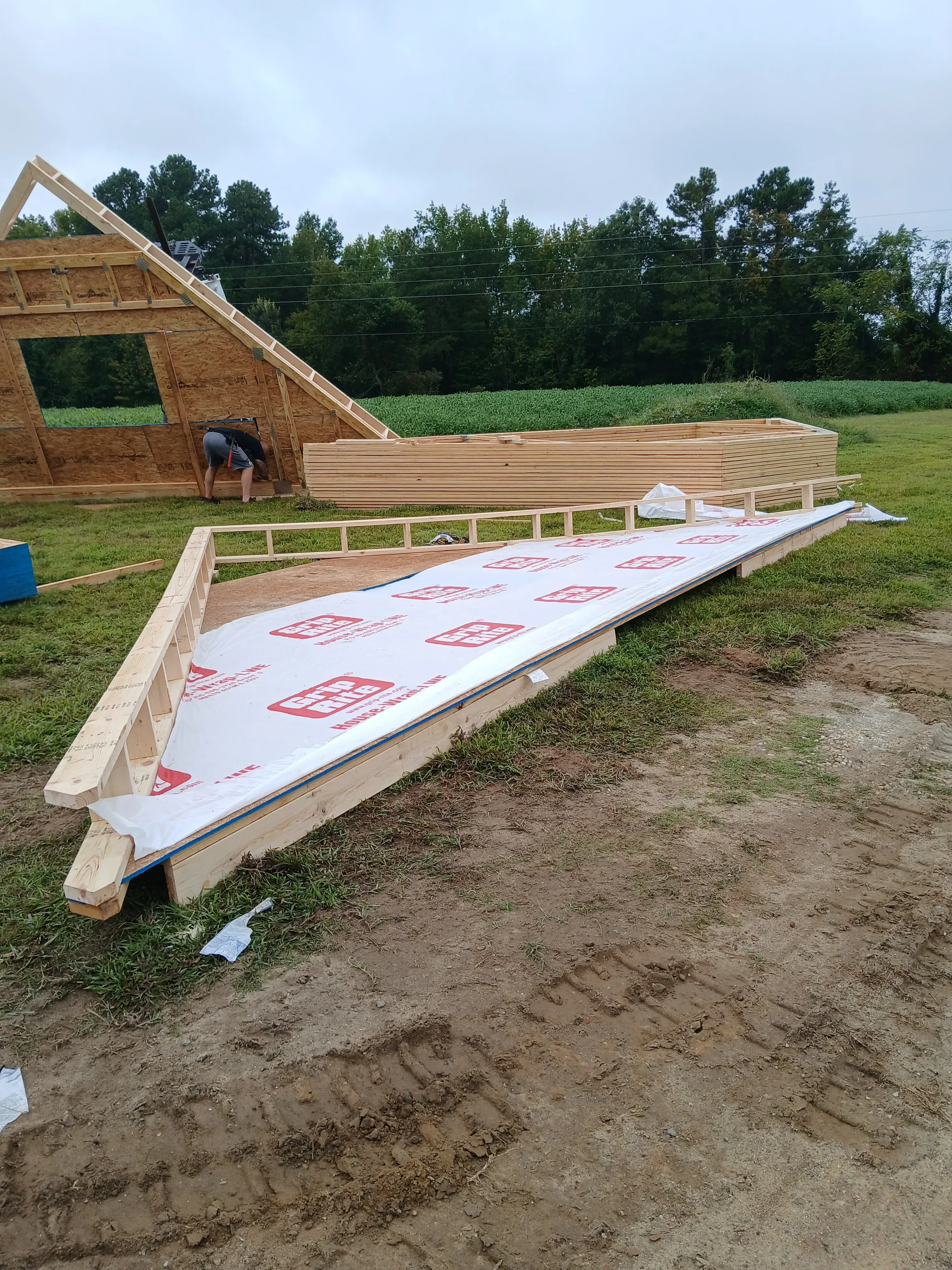 Roof framing with OSB sheathing and synthetic underlayment during installation